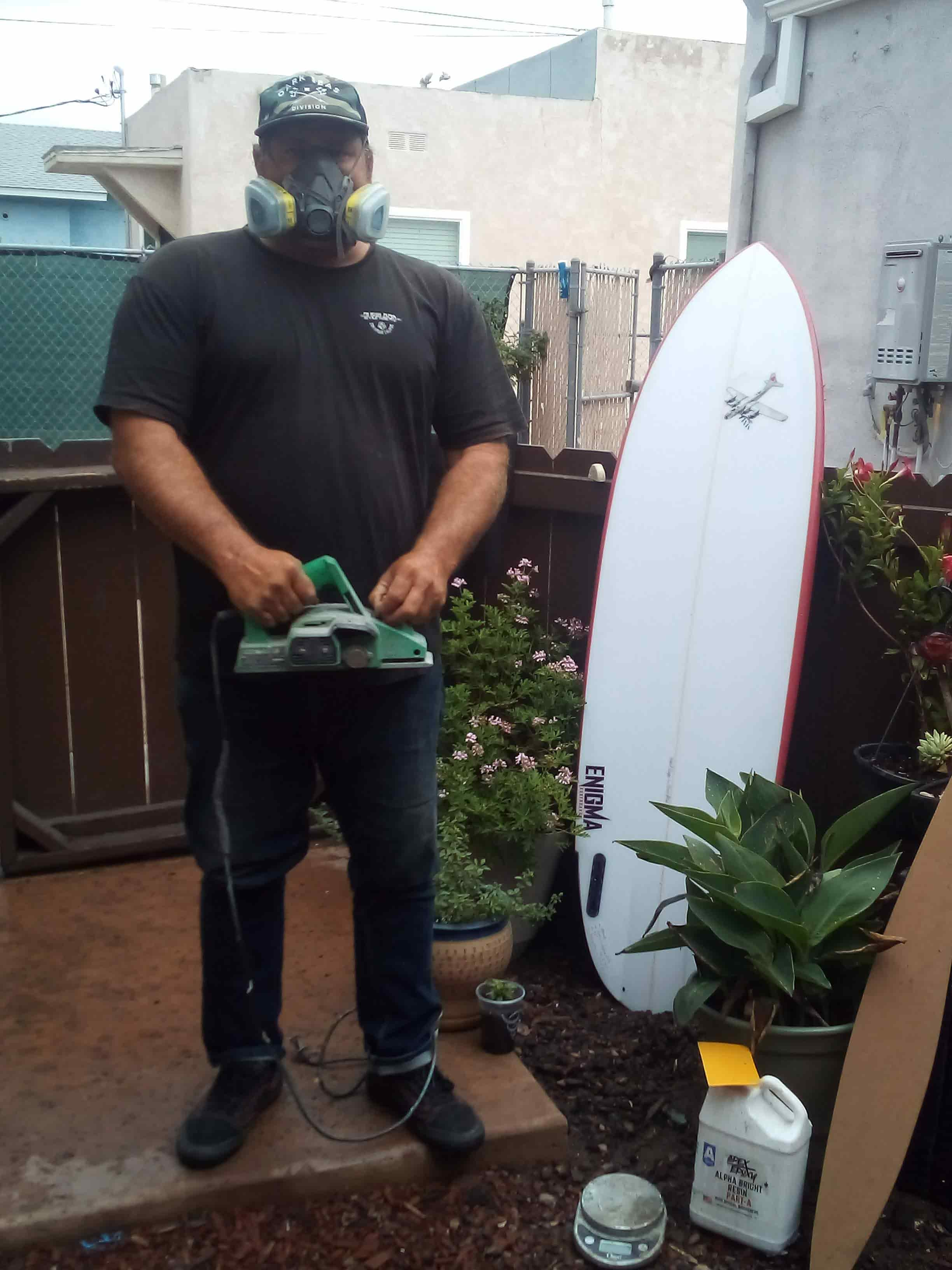 Shaping a surfboard in the shaping bay